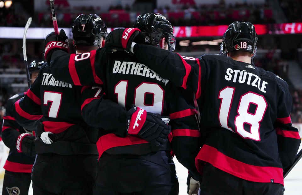 Ottawa Senators right wing Drake Batherson (19) celebrates his goal with teammates left wing Brady Tkachuk (7) and center Tim Stutzle (18) during the second period of an NHL hockey game against the Nashville Predators in Ottawa, Ontario, Monday, Jan. 29, 2024. (Sean Kilpatrick/The Canadian Press via AP)