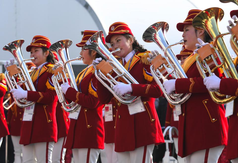 <p>North Korean cheerleaders perform during a welcoming ceremony for North Korea’s Olympic team at the Olympic Village in Gangneung on February 8, 2018 ahead of the Pyeongchang 2018 Winter Olympic Games. </p>