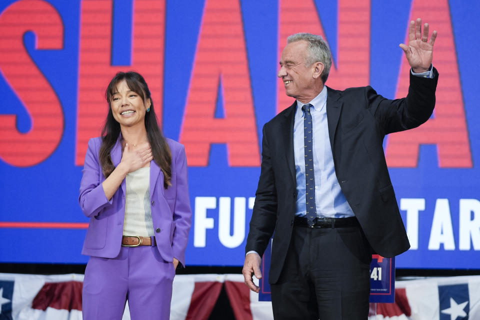 Presidential candidate Robert F. Kennedy Jr. right, waves on stage with Nicole Shanahan, after announcing her as his running mate, during a campaign event, Tuesday, March 26, 2024, in Oakland, Calif. (AP Photo/Eric Risberg)