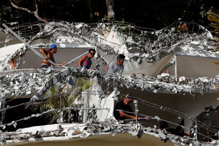 Filipino workers demolish West Cove resort two days before the temporary closure of the holiday island Boracay in the Philippines April 24, 2018. REUTERS/Erik De Castro