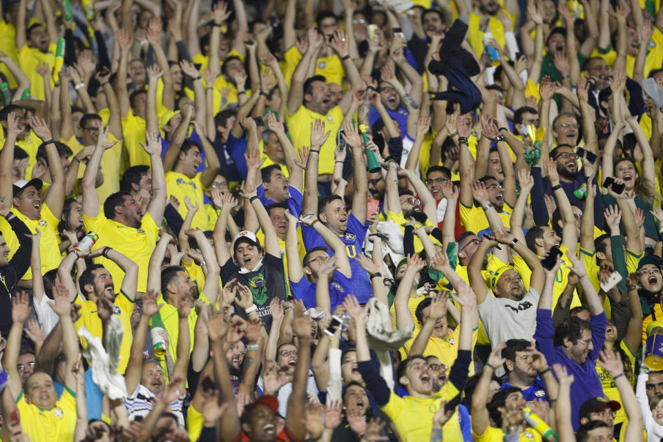 Fans cheer during a Copa America Group A soccer match between Brazil and Bolivia at the Morumbi stadium in Sao Paulo, Brazil, Friday, June 14, 2019. (AP Photo/Victor Caivano)