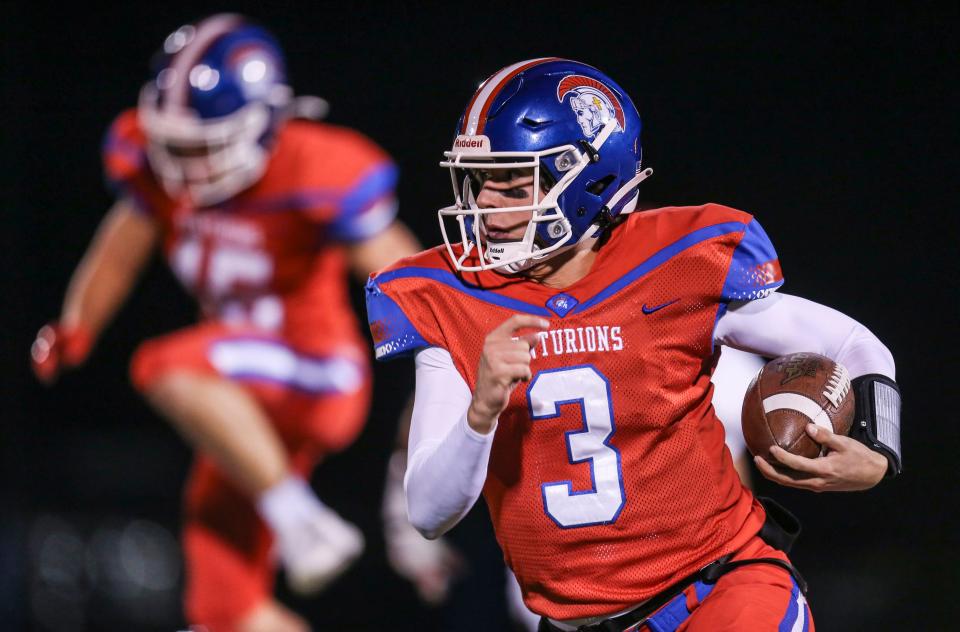 CAL's Cole Hodge runs for yardage against Henry County Friday night in high school football. He scored one of the Centurions touchdowns in the first quarter. Nov.5, 2021