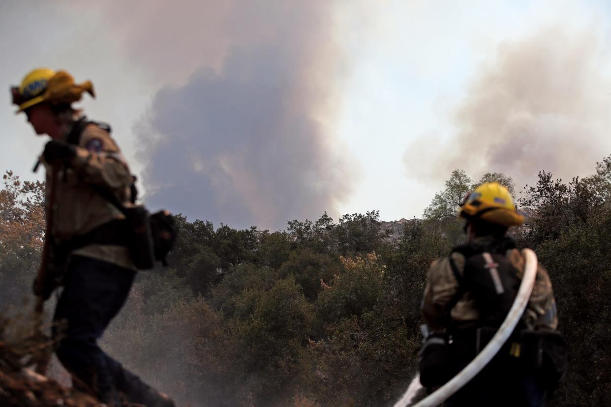 Firefighters work the Fairview Fire in the Avery Canyon in Hemet on Tuesday, Sept. 6, 2022. 