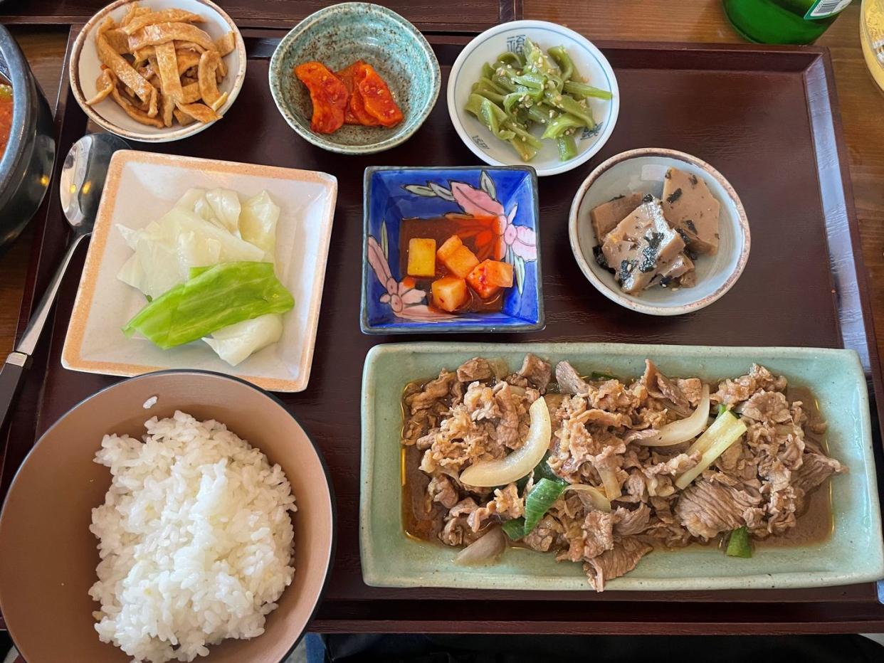 korean food photographed by chloe grace moretz travelling for the louis vuitton pre fall 2023 show