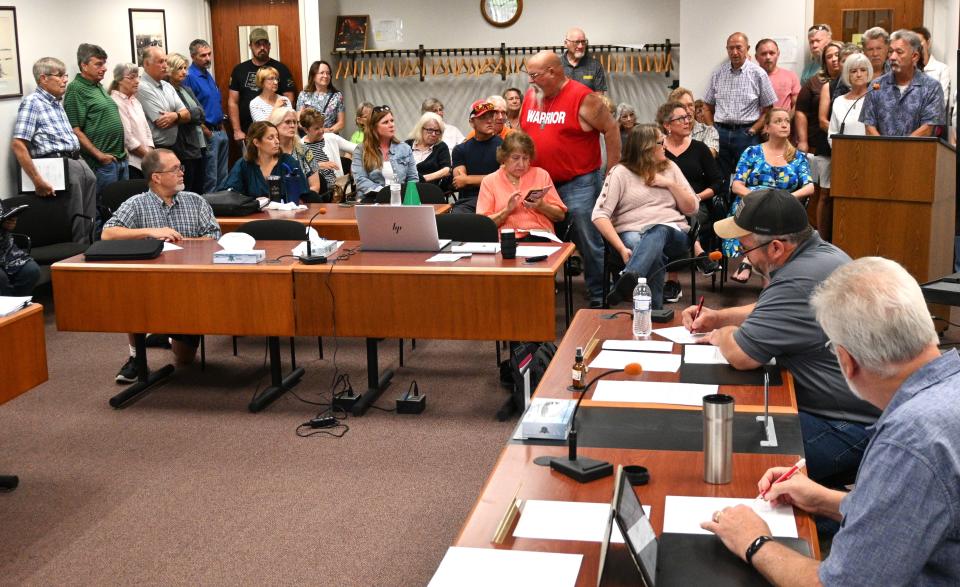 Some waited outside for time to speak on a proposed Constitutional County resolution Thursday during a Branch County Commission work session.