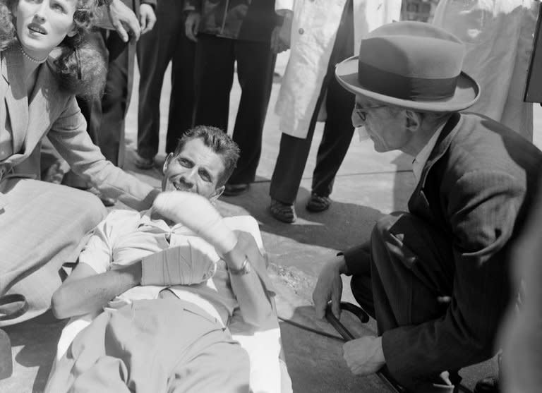 French climber Maurice Herzog is surrounded by relatives on his return to Paris on July 3, 1950 after his Annapurna expedition. Herzog, who conquered Annapurna in the first recorded ascent of a peak above 8,000 metres, has died at the age of 93