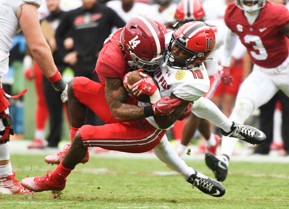 Alabama defensive back Brian Branch (14) tackles Austin Peay wide receiver Drae McCray (10) during the Crimson Tide's 34-0 victory on Nov. 19 at Bryant-Denny Stadium. McCray caught 12 passes for 92 yards in the game.