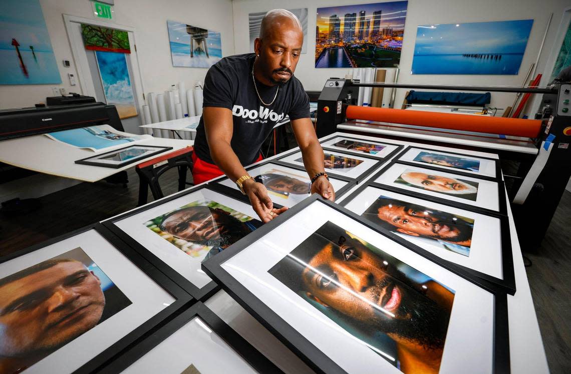 DJ Rahsaan “Fly Guy” Alexander displays his framed photographs of his new photo series “BPM- Beats Pics Masters” at Artful Printers in Miami on Friday, December 1, 2023.