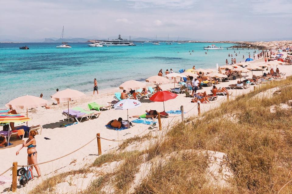 Relaxing on the beach in Formentera, Spain (David Švihovec / Unsplash)