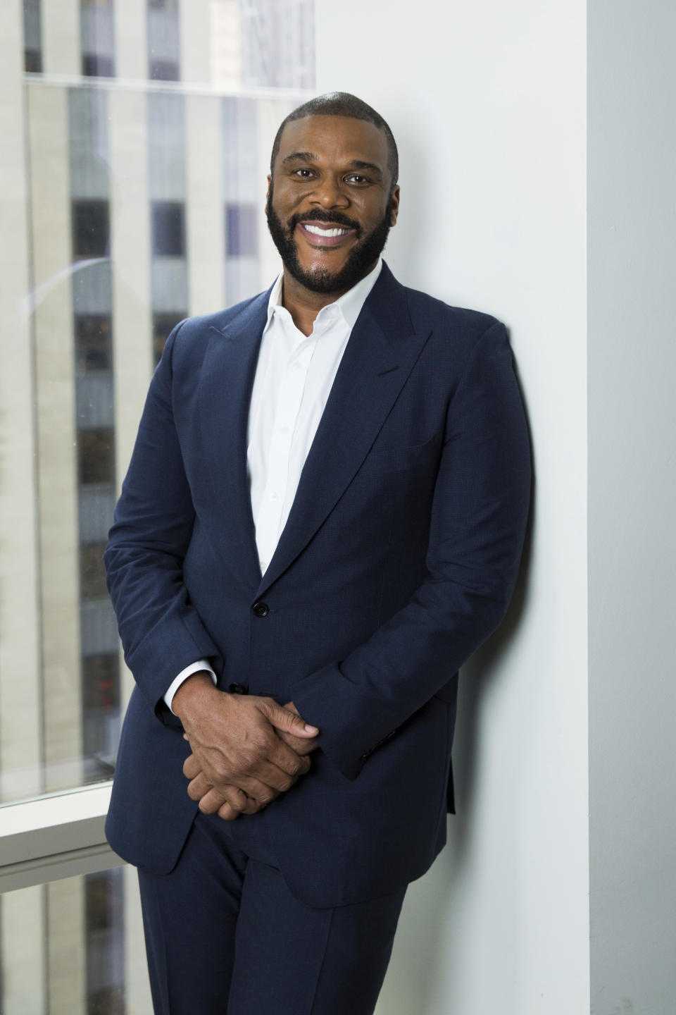 FILE - In this Nov. 16, 2017 photo, actor-filmmaker and author Tyler Perry poses for a portrait in New York. Perry and the Motion Picture and Television Fund are being honored with the Jean Hersholt Humanitarian Award, the Academy of Motion Picture Arts and Sciences said Thursday. Perry and the MPTF will receive their Oscar statuettes at the 93rd Academy Awards on April 25. (Photo by Amy Sussman/Invision/AP, File)