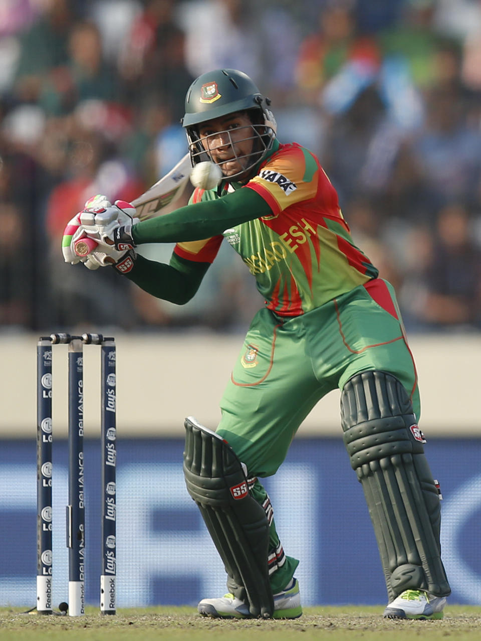 Bangladesh captain Mushfiqur Rahim plays a shot during their ICC Twenty20 Cricket World Cup match against Australia in Dhaka, Bangladesh, Tuesday, April 1, 2014. (AP Photo/Aijaz Rahi)