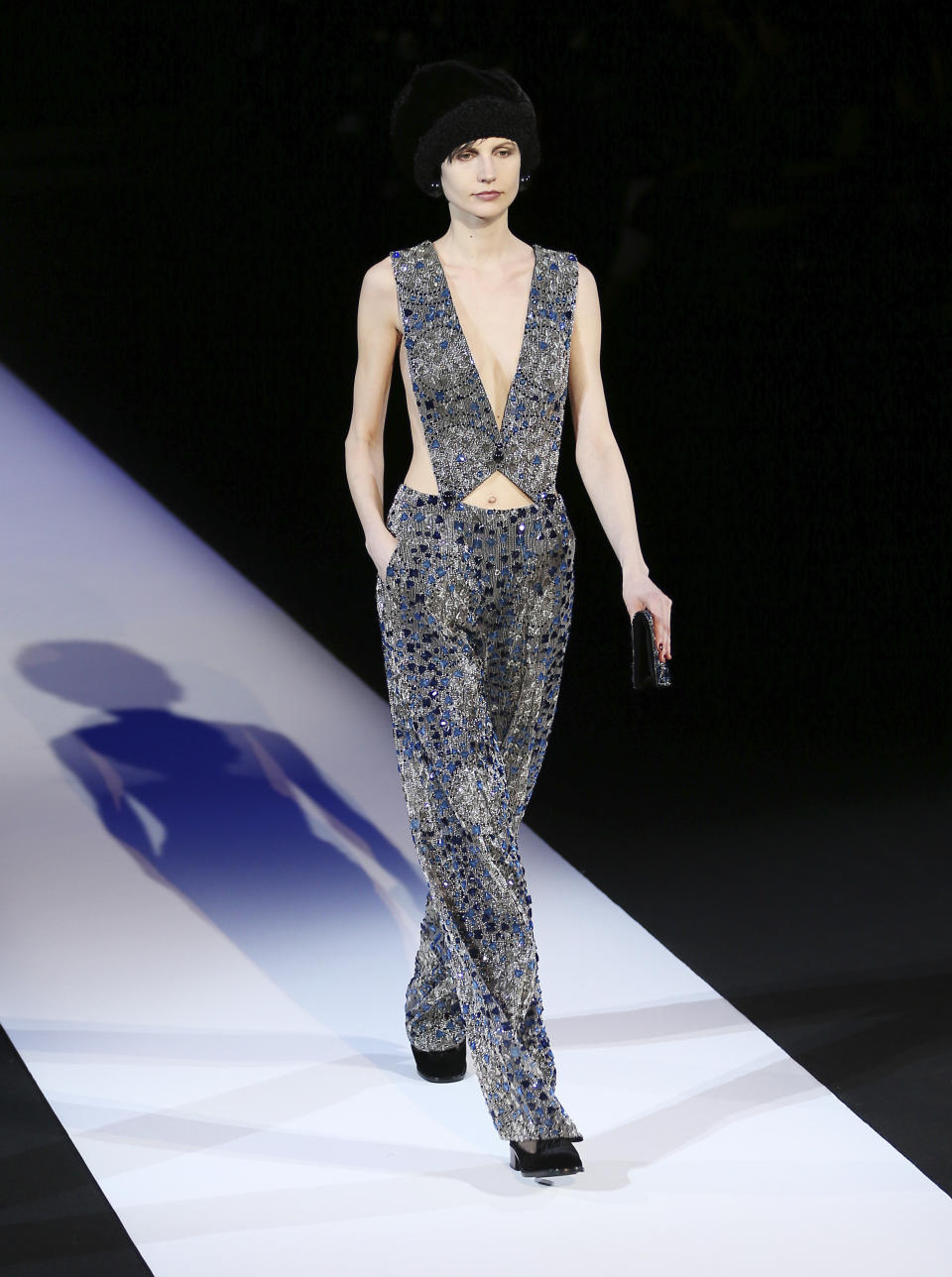 A model wears a creation for Giorgio Armani women's Fall-Winter 2013-14 collection, part of the Milan Fashion Week, unveiled in Milan, Italy, Monday, Feb. 25, 2013. (AP Photo/Antonio Calanni)