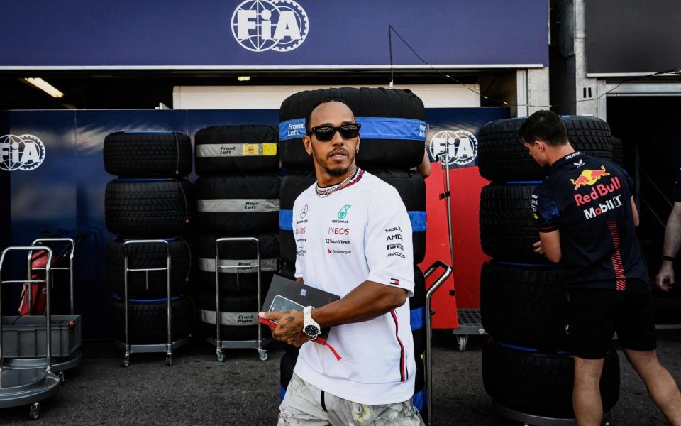 Mercedes' British driver Lewis Hamilton walks in the pit lane ahead of the Monaco Formula One Grand Prix at the Monaco street circuit in Monaco on May 25, 2023 - Getty Images/Jeff Pachoud