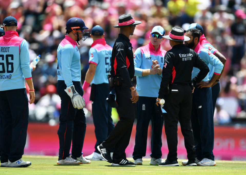 Eoin Morgan of England (C) speaks to the umpires as Rassie van der Dussen of South Africa is given not out on review during the 3rd One Day International match between England and South Africa on February 09, 2020 in Johannesburg, South Africa.