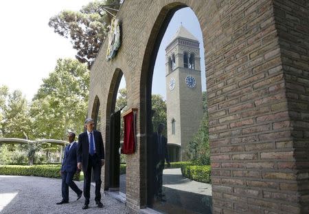 Britain's Foreign Secretary Philip Hammond (R) and non-resident charge d'affaires Ajay Sharma arrive to unveil a plague to mark the re-opening of the British Embassy in Tehran, Iran August 23, 2015. REUTERS/Darren Staples