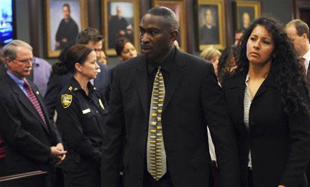 Jordan Davis' father Ronald Davis (C) leaves the courtroom with his wife Carolina (R) as court recessed for the jury to reconsider the first charge against Michael Dunn in Jacksonville, Florida February 15, 2014. REUTERS/ Bob Mack/Florida Times-Union/Pool