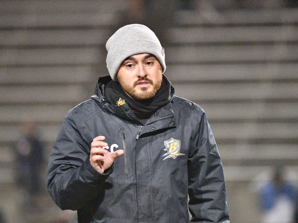 Golden West High School girls soccer head coach Jose "Chiva" Cuevas speaks to the team postgame after a loss to Redwood on Jan. 18, 2024 at Mineral King Bowl. Cuevas, a former Farmersville standout and pro player, is in his first season as the Trailblazers' head coach.