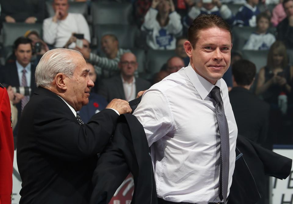 TORONTO, ON - NOVEMBER 11: Pavel Bure is presented with his Hall of Fame jacket by Jim Gregory prior to the Hockey Hall of Fame Legends Game at the Air Canada Centre on November 11, 2012 in Toronto, Canada. Bure will be inducted into the Hockey Hall of Fame at a ceremony at the Hall on November 12. (Photo by Bruce Bennett/Getty Images)