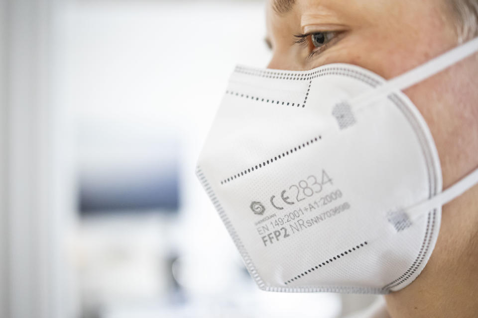 BERLIN, GERMANY - DECEMBER 15: Symbol photo on the subject of FFP2 mask. A woman wears an FFP2 mask on December 15, 2020 in Berlin, Germany. (Photo by Thomas Trutschel/Photothek via Getty Images)