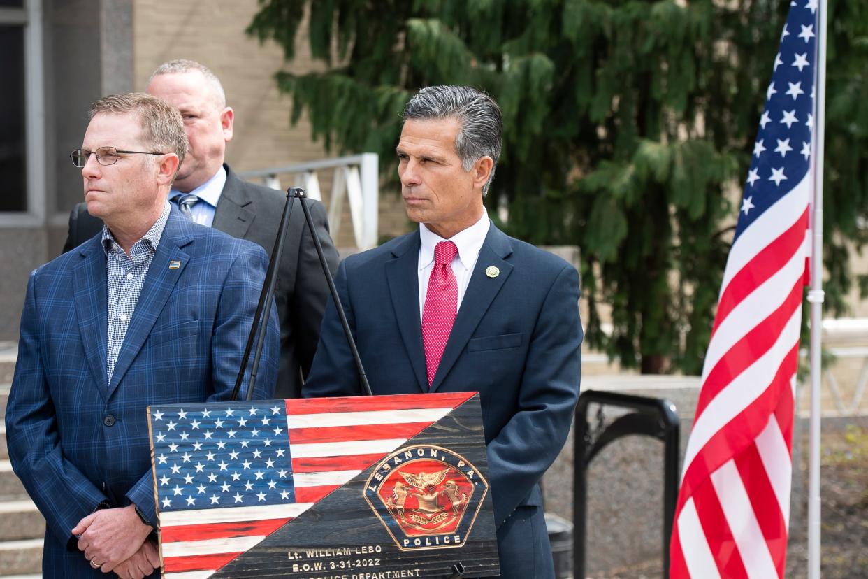 U.S. Rep. Dan Meuser (at right) listens to a speaker during a dedication ceremony for Lt. William Lebo on March 31, 2023.