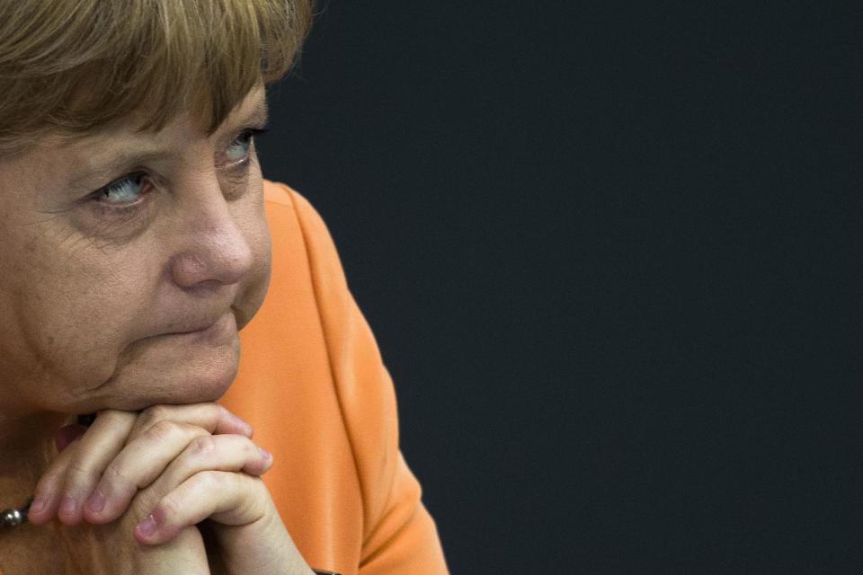 German Chancellor Angela Merkel attends the the first session of the budget 2013 debate at the parliament Bundestag in Berlin, Germany, Tuesday, Sept. 11, 2012. On Wednesday Merkel and her government face a rule of Germany's Federal Constitutional Court about the legitimacy of the European Stability Mechanism and the Fiscal Compact for Germany. (AP Photo/Markus Schreiber)