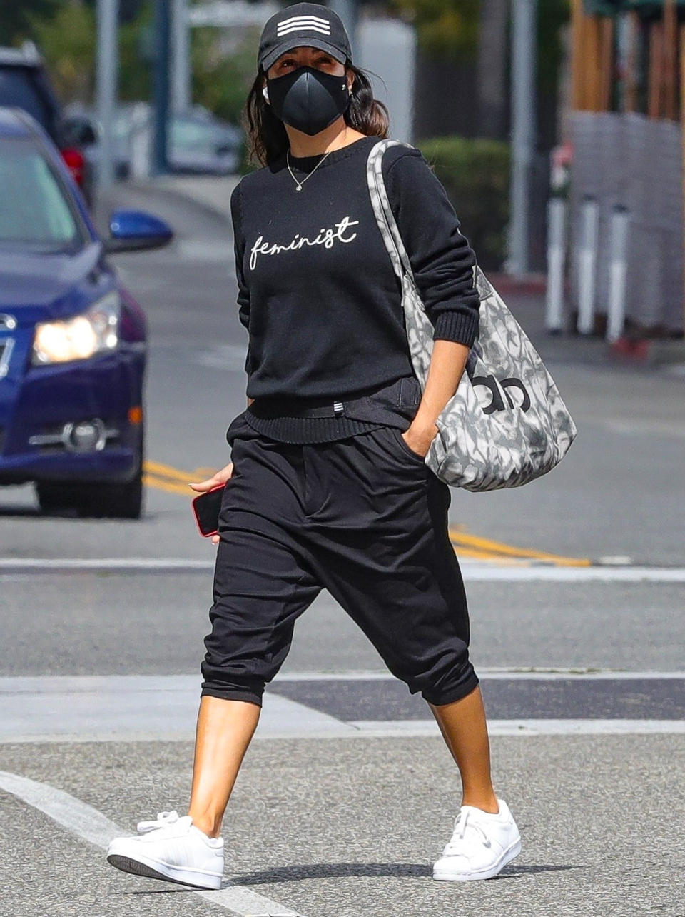 <p>Eva Longoria wears a "feminist" sweater in celebration of International Women's Day while out shopping on Monday in Beverly Hills.</p>