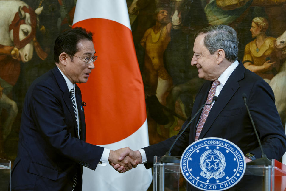 Japanese Prime Minister Fumio Kishida, left, and Italian Premier Mario Draghi shake hands at the end of press point at Chigi Palace government office in Rome, Wednesday, May 4, 2022. Kishida is in Italy and the Vatican, where he met Pope Francis, as part of a six-nation overseas trip. (AP Photo/Domenico Stinellis)