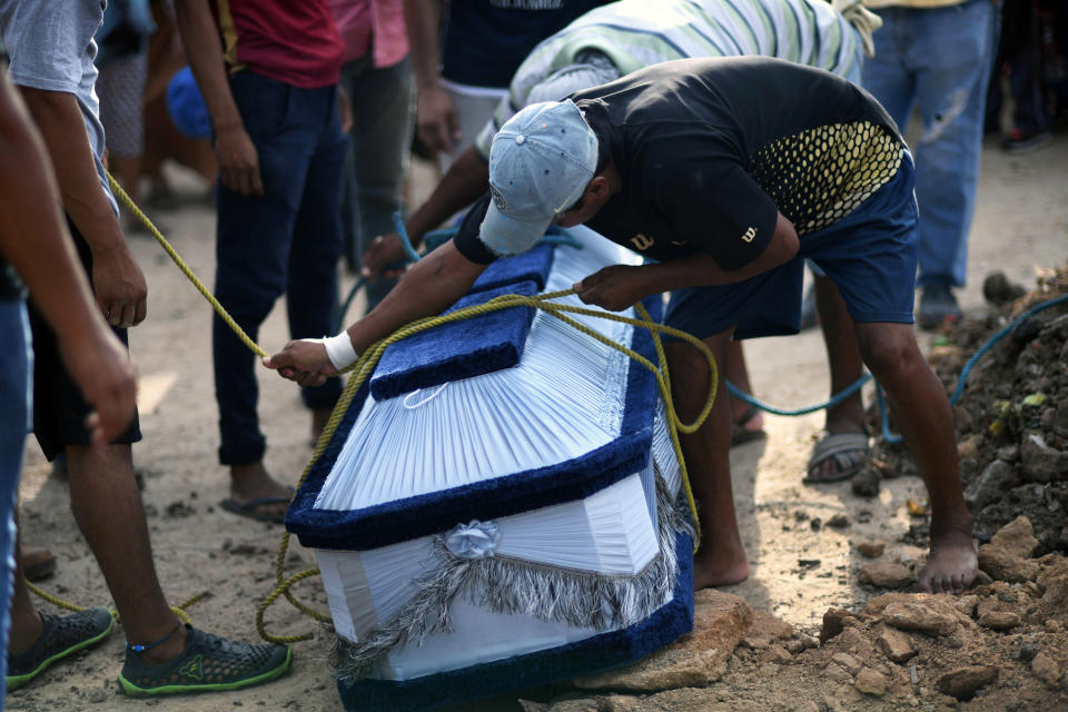 <p>The coffin of 85-year-old Casimiro Rey, one of the victims of an 8.2 magnitude earthquake that hit Mexico’s Pacific coast overnight, is prepared for burial during his funeral on Sept. 8, 2017 in Juchitan de Zaragoza, state of Oaxaca. (Photo: Pedro Pardo/AFP/Getty Images) </p>