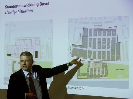 CEO Severin Schwan of Swiss drugmaker Roche stands in front of a plan of the Roche headquarters during a news conference in Basel October 22, 2014. REUTERS/Arnd Wiegmann