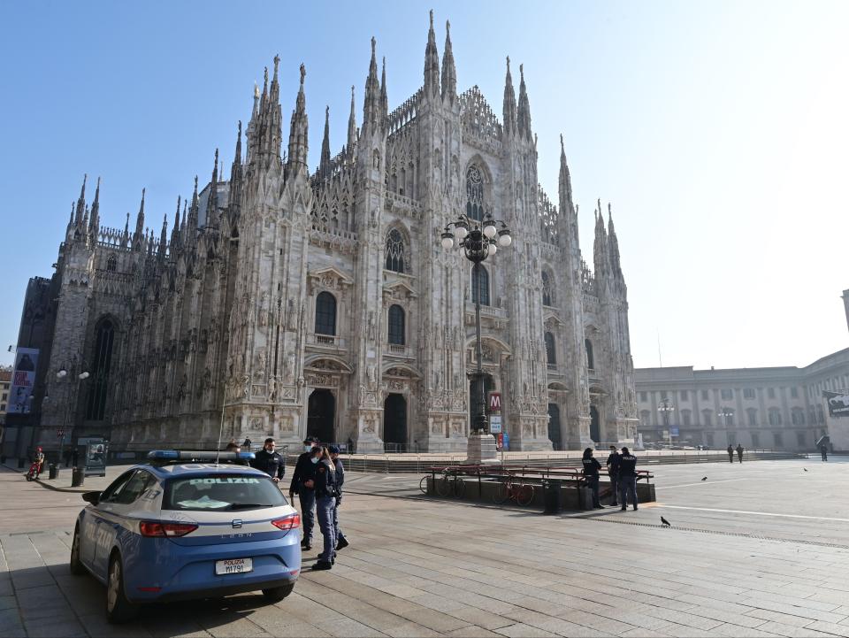 Police officers patrol in front of Milan’s Duomo amid local lockdown measuresAFP via Getty Images