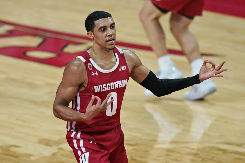 Wisconsin's D'Mitrik Trice reacts after sinking a 3-point basket during the second half of the team's NCAA college basketball game against Rutgers, Friday, Jan. 15, 2021, in Piscataway, N.J. Wisconsin won 60-54. (AP Photo/Seth Wenig)