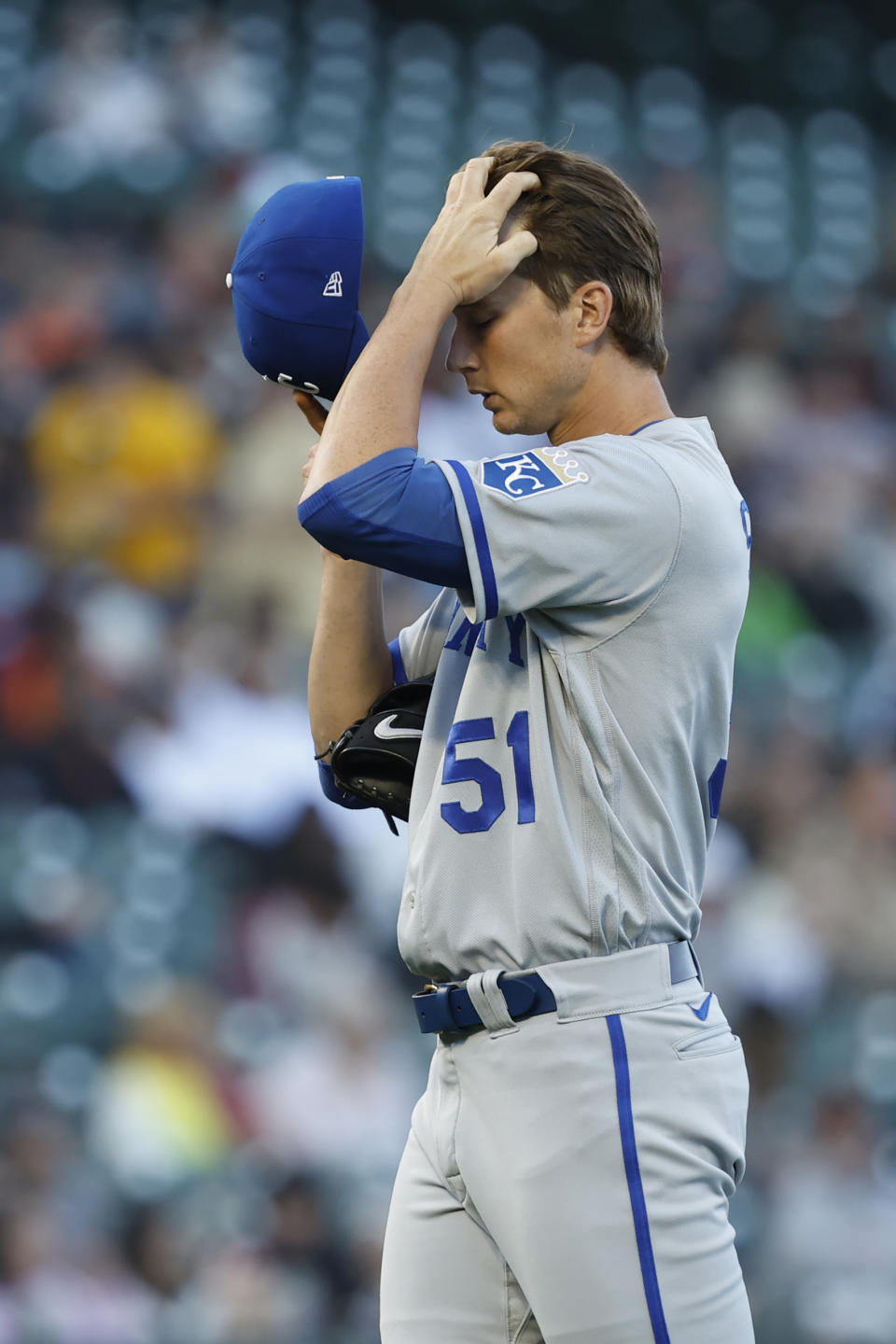 Kansas City Royals starting pitcher Brady Singer reacts after walking in a run in the third inning of a baseball game against the San Francisco Giants in San Francisco, Monday, June 13, 2022. (AP Photo/Josie Lepe)