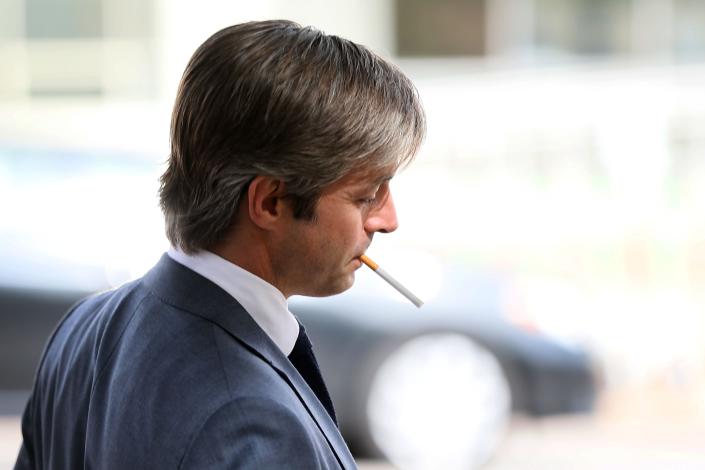 Andino Reynal, Alex Jones' lawyer, shown smoking outside the court Thursday, asked jurors to award only a total of $8.