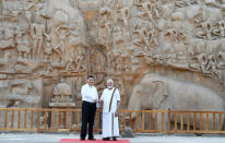 In this Friday, Oct. 11, 2019, handout photo provided by the Indian Prime Minister's Office, Chinese President Xi Jinping and Indian Prime Minister Narendra Modi shake hands at Arjuna's Penance in Mamallapuram, India. Xi on Friday met with Modi at a time of tensions over Beijing's support for Pakistan in opposing India's downgrading of Kashmir's semi-autonomy and continuing restrictions on the disputed region. (Indian Prime Minister's Office via AP)