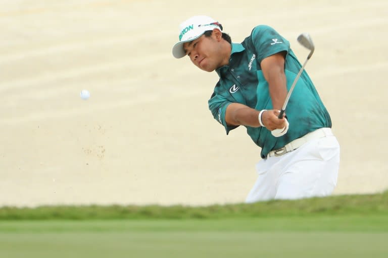 Hideki Matsuyama of Japan chips from a greenside bunker on the third hole during round three of the Hero World Challenge at Albany, The Bahamas on December 3, 2016