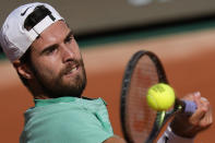 Russia's Karen Khachanov plays a shot against Serbia's Novak Djokovic during their quarterfinal match of the French Open tennis tournament at the Roland Garros stadium in Paris, Tuesday, June 6, 2023. (AP Photo/Thibault Camus)