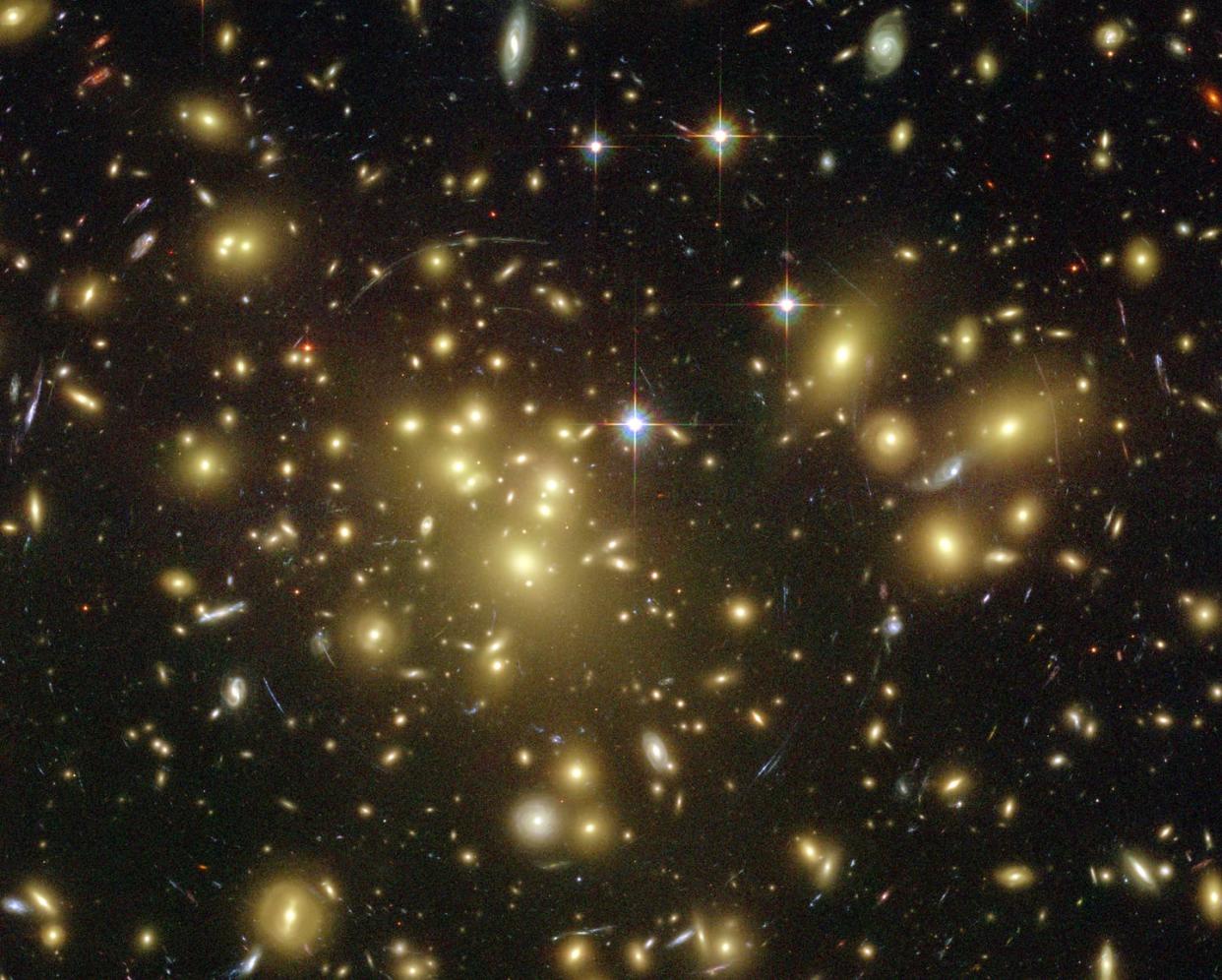 <span class="caption">Dark matter can be inferred from an assortment of physical clues in the universe.</span> <span class="attribution"><a class="link " href="https://en.wikipedia.org/wiki/Dark_matter#/media/File:Gravitationell-lins-4.jpg" rel="nofollow noopener" target="_blank" data-ylk="slk:NASA;elm:context_link;itc:0;sec:content-canvas">NASA</a></span>