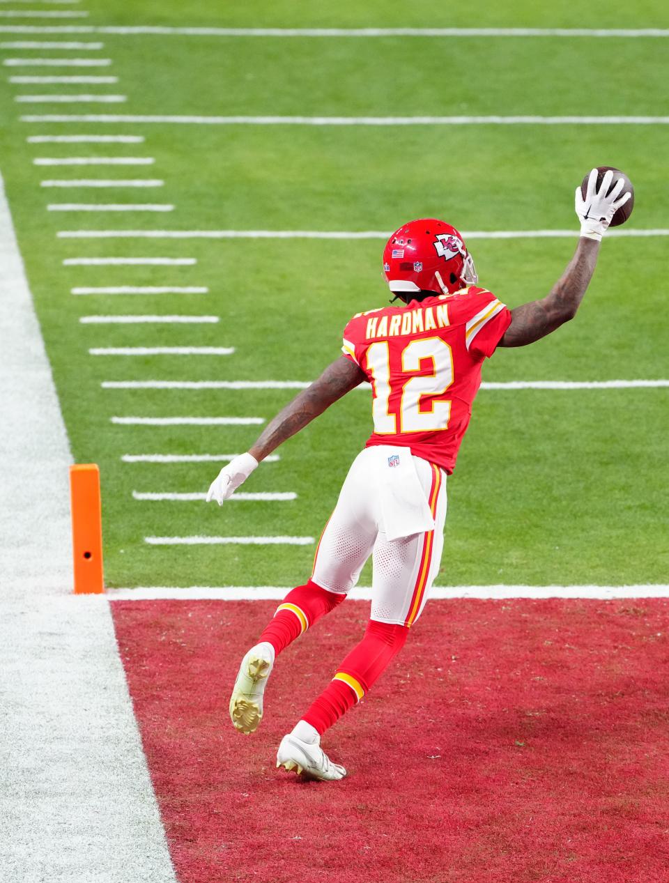 Kansas City Chiefs wide receiver Mecole Hardman Jr. (12) scores the winning touchdown against the San Francisco 49ers during overtime in Super Bowl LVIII at Allegiant Stadium.