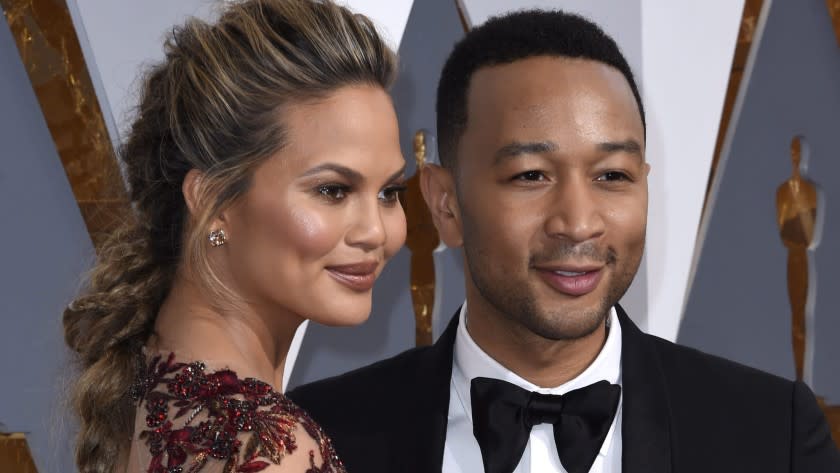 Chrissy Teigen and John Legend are seen at the 88th annual Academy Awards in February 2016.