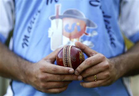 A player from a team of priests and seminarians holds a cricket ball during a training session at the Maria Mater Ecclesiae's Catholic College in Rome October 22, 2013. REUTERS/Alessandro Bianchi