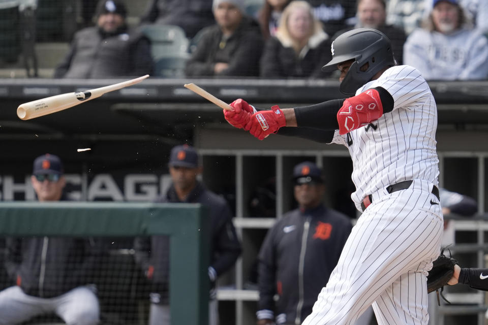 Chicago White Sox's Eloy Jimenez breaks his bat as he grounds out during the first inning of a baseball game against the Detroit Tigers in Chicago, Sunday, March 31, 2024. (AP Photo/Nam Y. Huh)