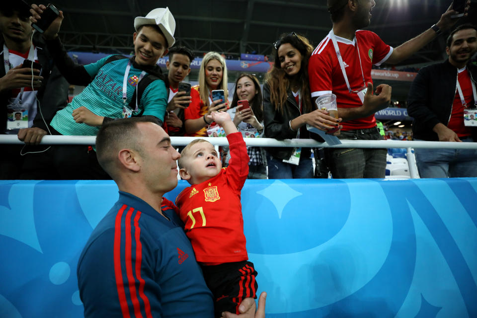 <p>Aspas of Spain speaks with his family during the warm up prior to the 2018 FIFA World Cup Russia group B match between Spain and Morocco at Kaliningrad Stadium on June 25, 2018 in Kaliningrad, Russia. (Photo by Jamie Squire – FIFA/FIFA via Getty Images) </p>