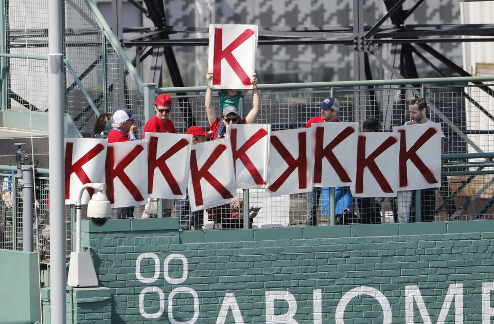 A fan holds up a "K" after Boston Red Sox starting pitcher Chris Sale struck out his tenth batter during the sixth inning of a baseball game against the Houston Astros Sunday, May 19, 2019, at Fenway Park in Boston. (AP Photo/Winslow Townson)