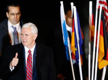 U.S. Vice President Mike Pence gestures as he arrives in Munich, Germany, February 17, 2017. REUTERS/Michaela Rehle