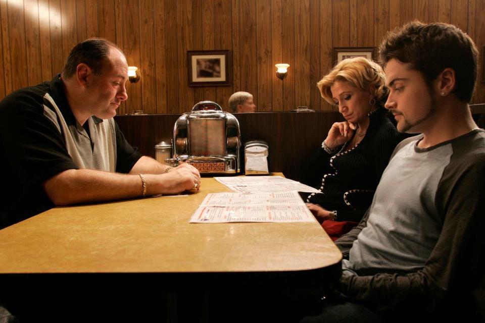 <p>hbo</p> James Gandolfini, Edie Falco and Robert Iler in the booth up for sale during The Sopranos series finale.