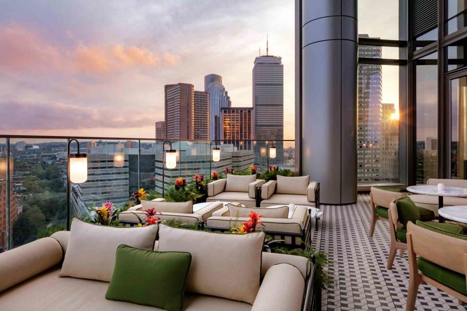 <p>Courtesy of Raffles Boston</p> The terrace at Raffles Boston, with views of the Boston skyline.