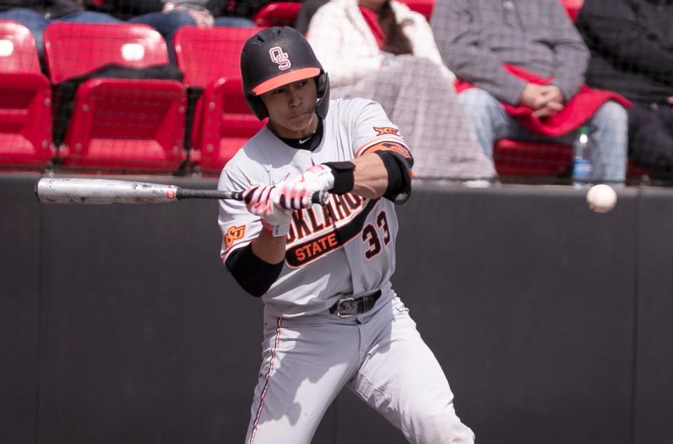 Oklahoma State's Chase Adkison (33) prepares to hit the ball against Texas Tech in game two of the Big 12 home opener, Saturday, March 18, 2023, at Rip Griffin Park. 
