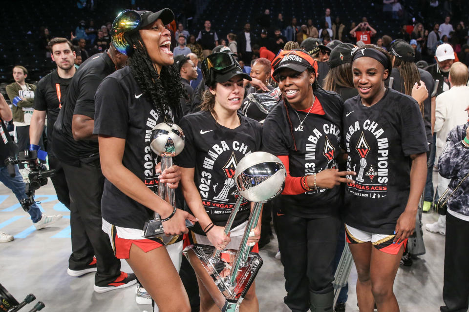 The Las Vegas Aces' core four of A'ja Wilson (L), Kelsey Plum, Chelsea Gray and Jackie Young celebrate after winning the 2023 WNBA championship on Oct. 18, 2023. (Wendell Cruz/USA TODAY Sports)
