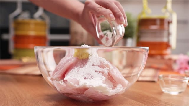 marinate fish fillets with ginger sauce in a bowl