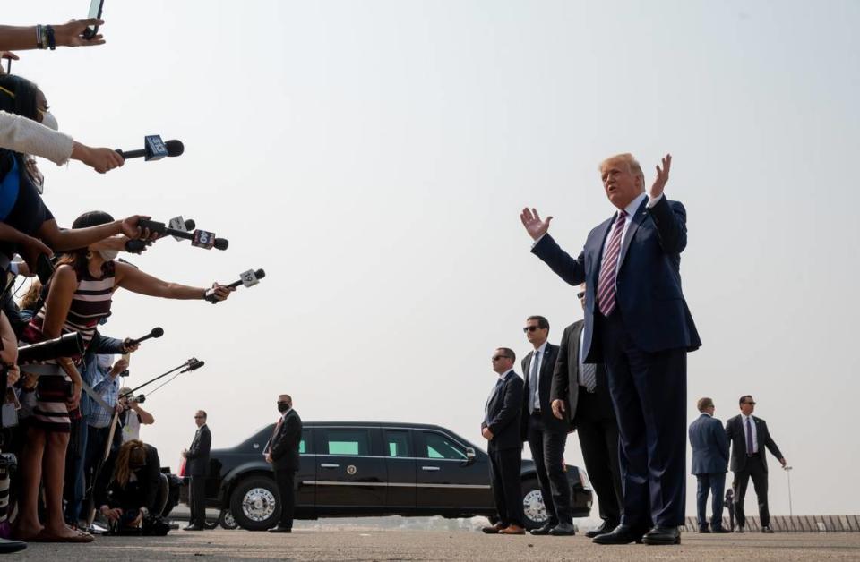 President Donald Trump speaks to the media before he meets with California Gov. Gavin Newson and other government officials to discuss wildfires at Sacramento McClellan Airport on Monday, Sept. 14, 2020.